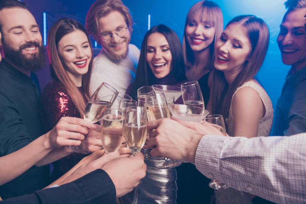 happy friends out to drink at a bar in houston texas