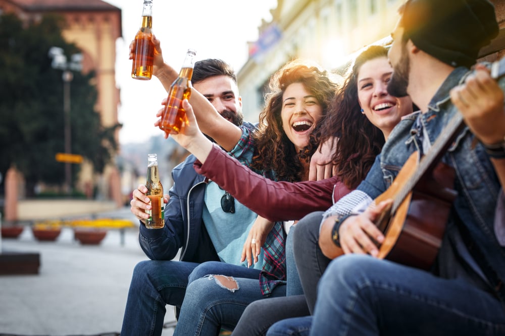 Group of young friends hangout on street in downtown