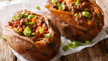 Homemade baked sweet potato stuffed with beef meat