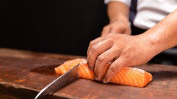 Japanese chef making sushi at restaurant