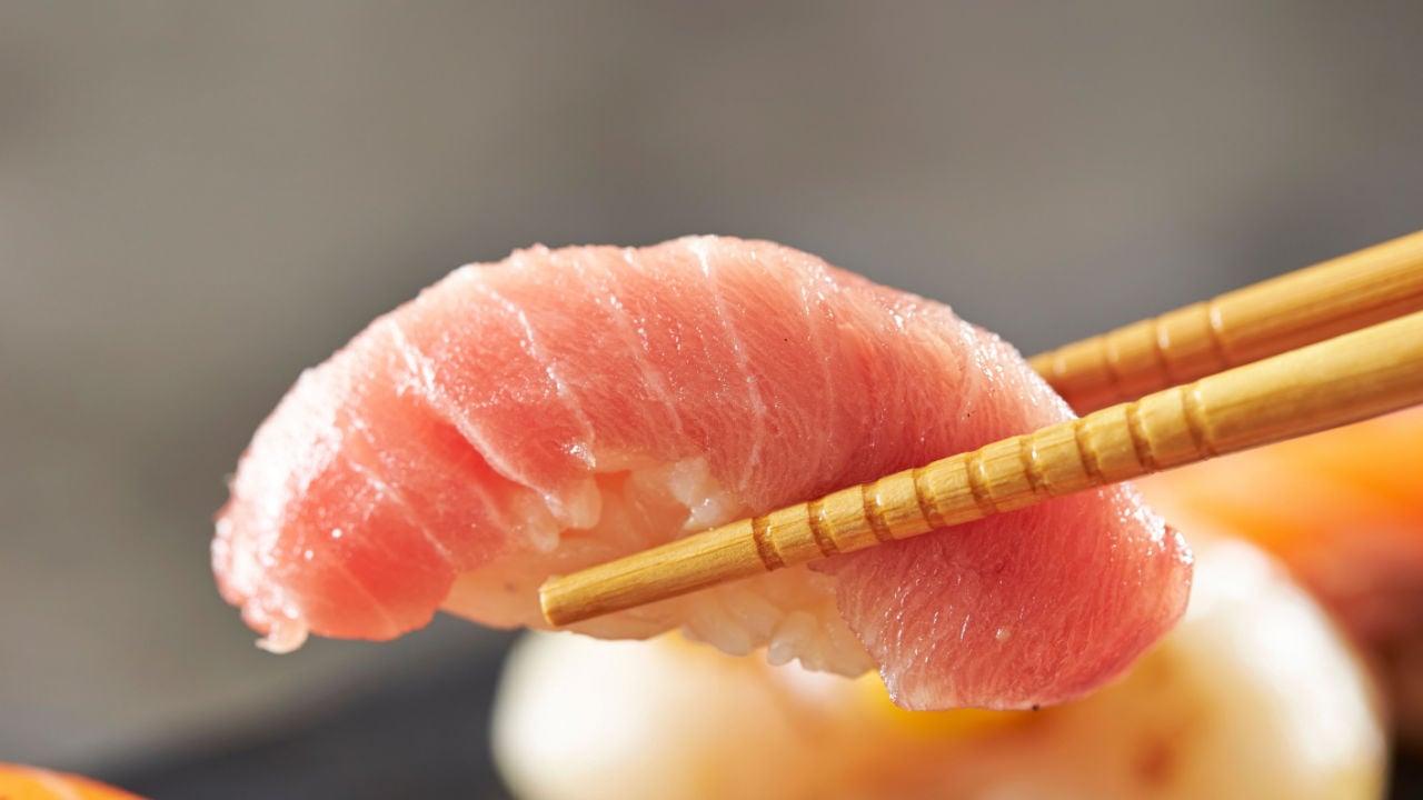 Tuna sushi on chopsticks, Tuna sushi