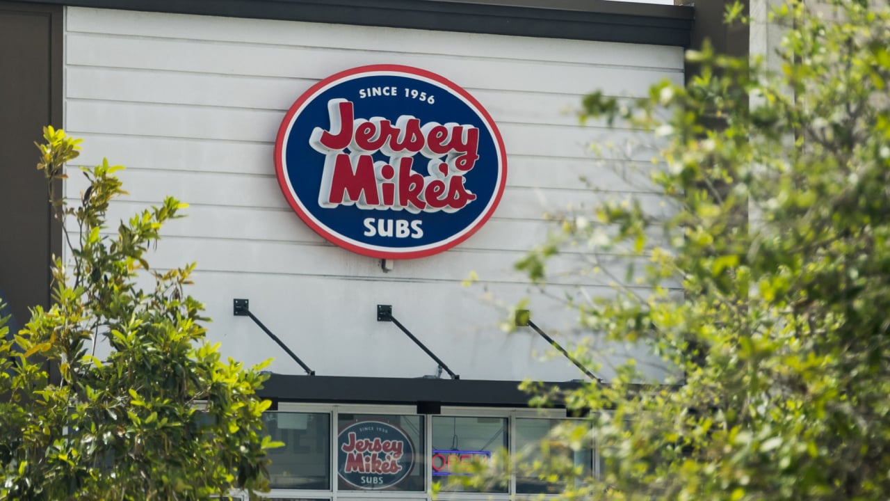 The sign of a Jersey Mike's graces the front of a building facade
