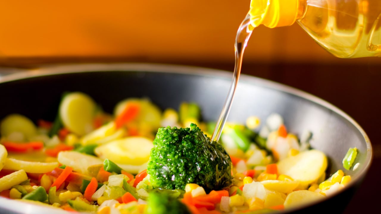 black pan with different vegetables and oil