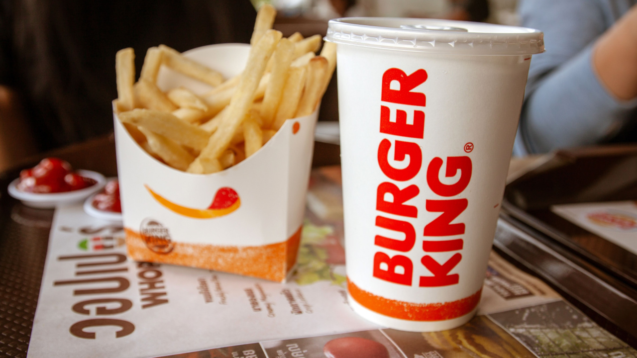 Burger King Cola Cup and Potato french fries on the table.