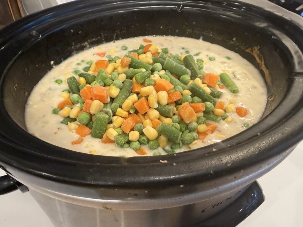 Frozen peas, carrots, corn and green beans added to the creamy filling