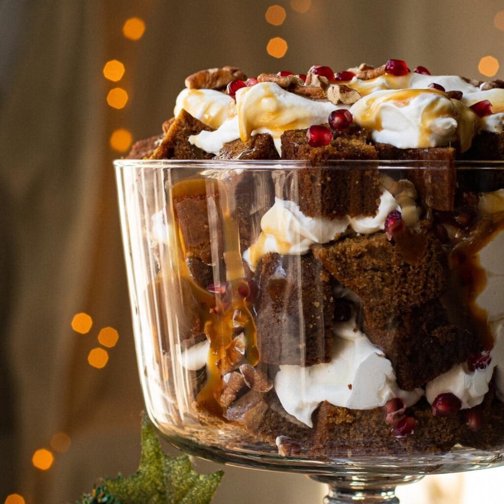 Gingerbread trifle with caramel, bourbon cream, pecans and pomegranate