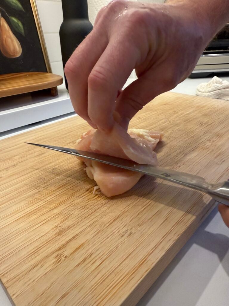 slicing each chicken breast
